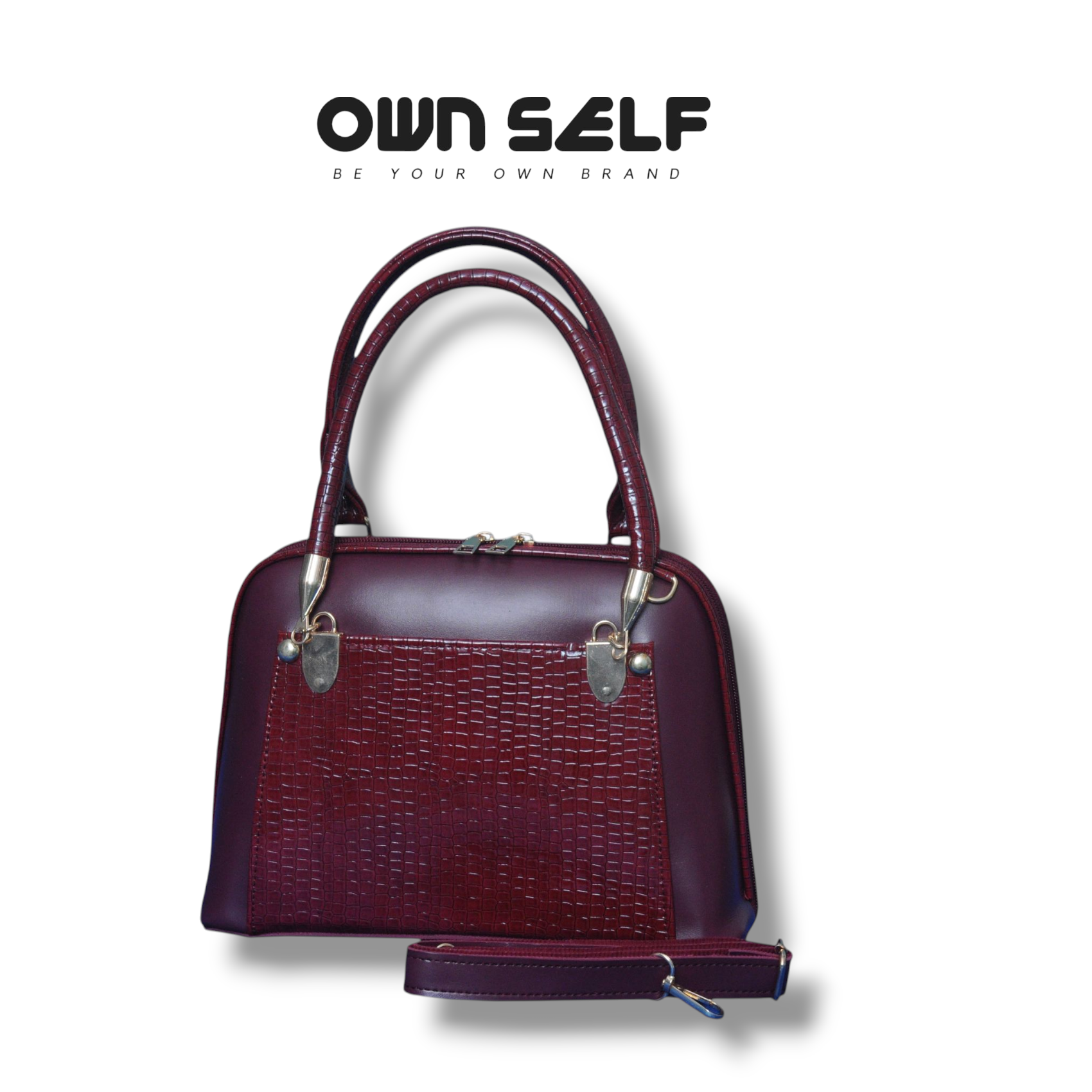 Maroon handbag with silver accents on a white background, featuring 'OWN SELF' branding.